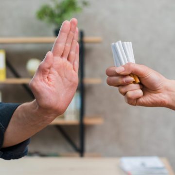 man-refusing-bunch-cigarettes-offered-by-his-female-friend